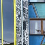 Architectural detail, including a mural featuring a black cat.