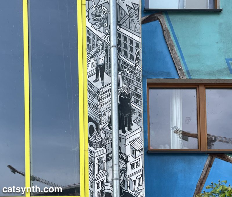 Architectural detail, including a mural featuring a black cat.